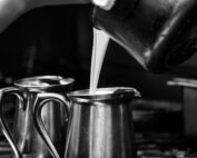 Staff Pouring Liquid for food prep